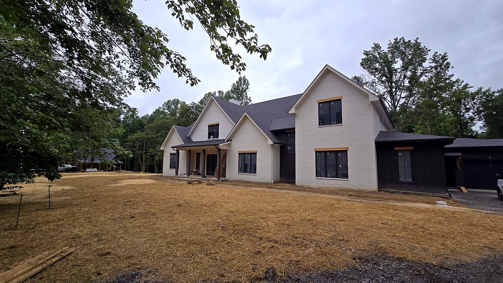 Custom modern farmhouse, front angle — Franklin, TN by Muller Homes