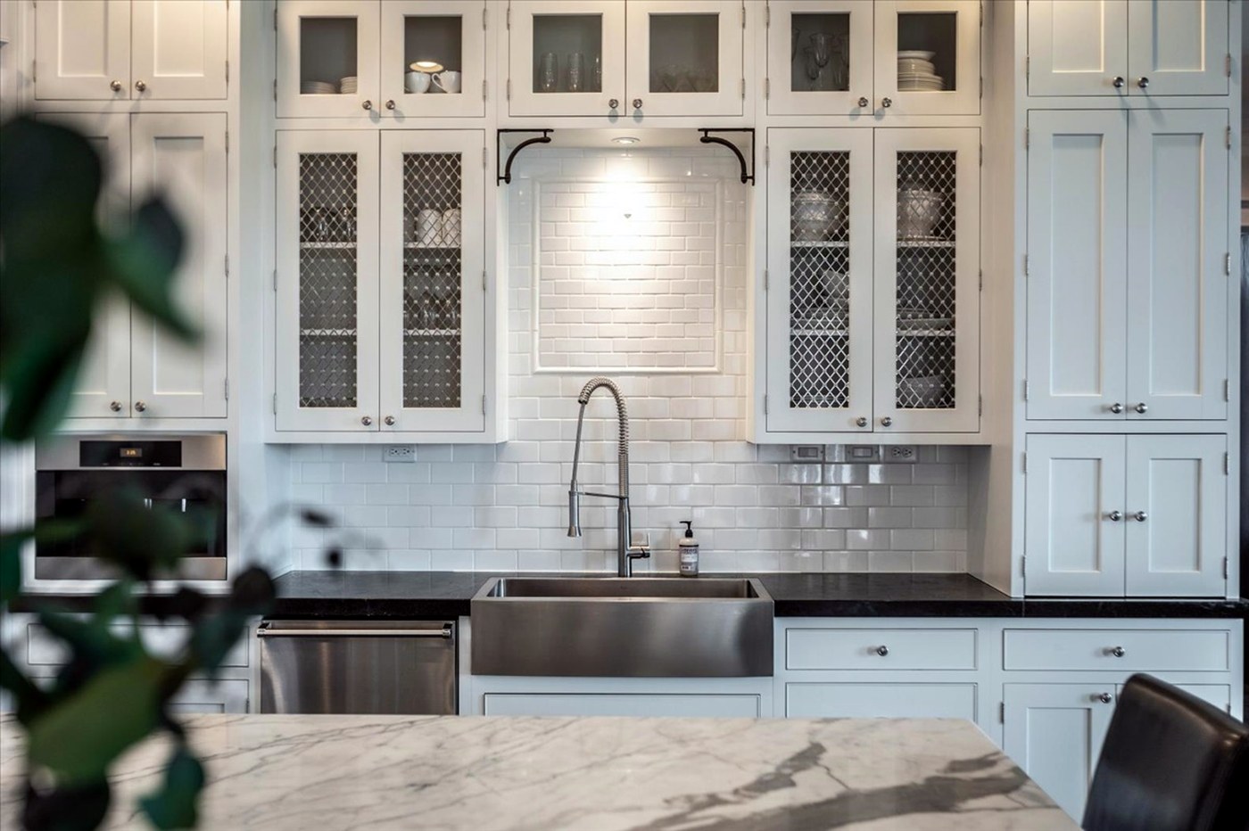 Longwood kitchen detail — subway tile, farmhouse sink and marble counters