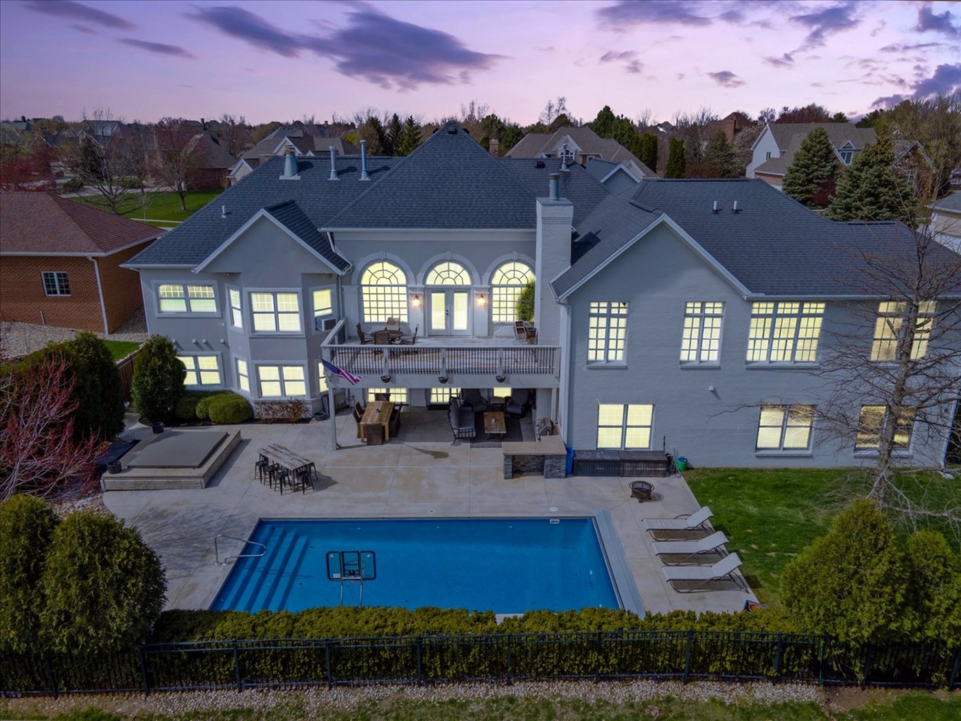 Longwood renovation — rear elevation with pool at dusk, Normal IL