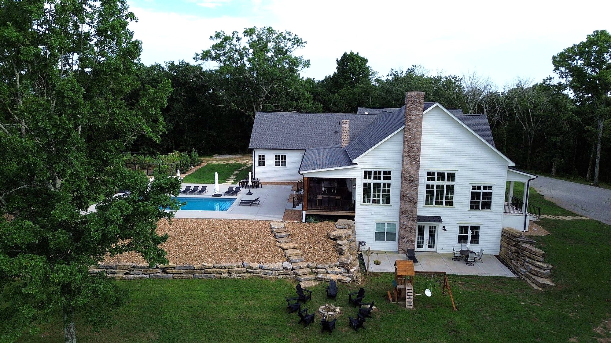 Aerial of custom home, pool and fire pit — Columbia, TN