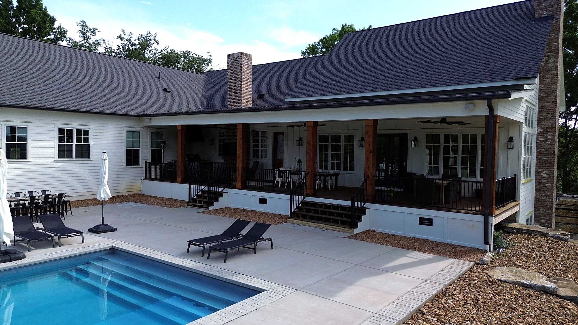 Covered back porch and pool — custom home in Columbia, TN by Muller Homes